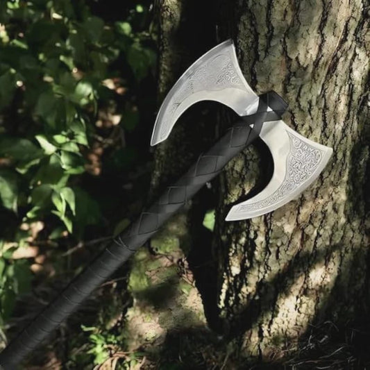 A collection of hand-forged battle-ready Viking swords and bearded axes made of 1095 high carbon steel by Valknut Warrior