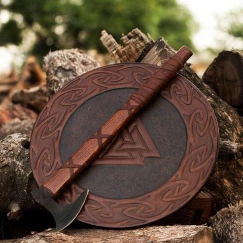 Hand-engraved Valknut symbol on a handcrafted Viking wooden shield