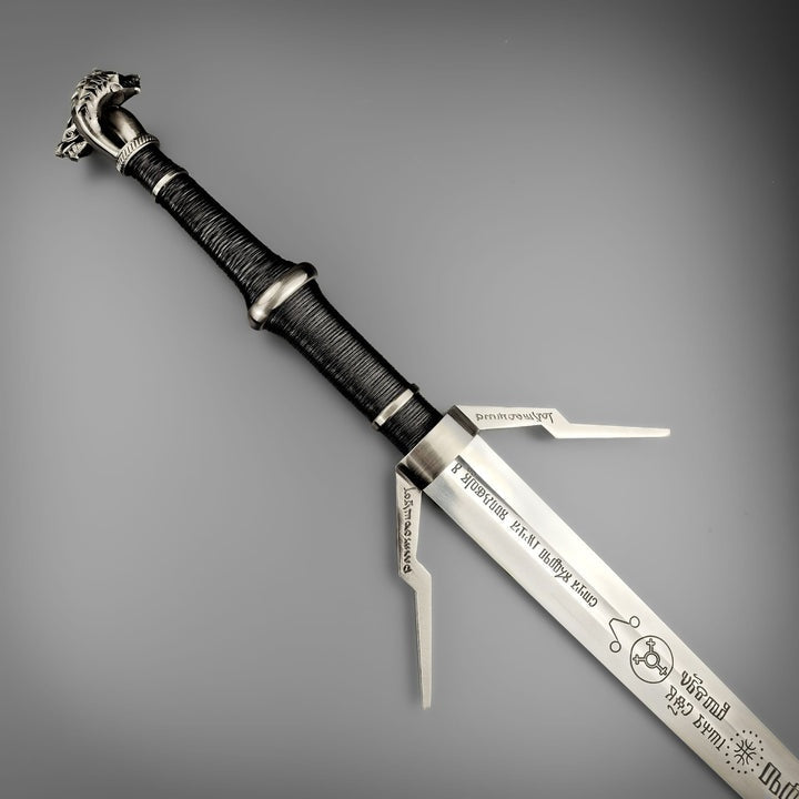 Geralt of Rivia Silver Sword replica from The Witcher 3 with twin wolf pommel and engraved runes on high carbon steel blade.